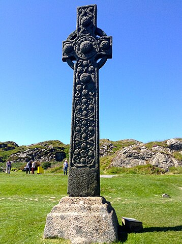 A tall, ornate stone cross