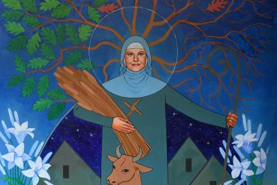A portion of a painting of St. Brigid, wearing a nun's habit and holding sheaves of wheat